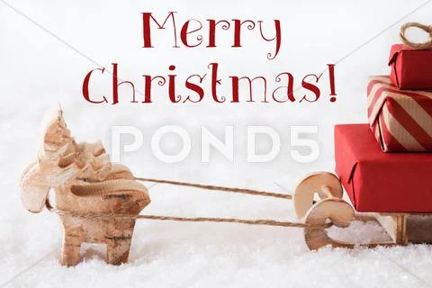 Reindeer With Sled On Snow, Text Merry Christmas Stock Photos