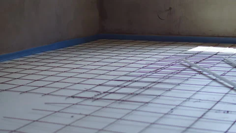Reinforcement grid for underfloor heating installation Stock Footage 311976682