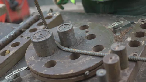 Reinforcing bars bend precisely on mechanical bender 動画素材 311893468