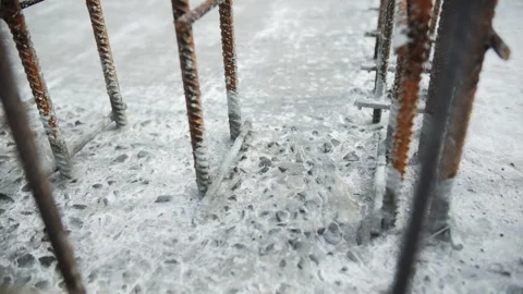Reinforcing steel bars embedded in cured concrete Stock Footage 306335685