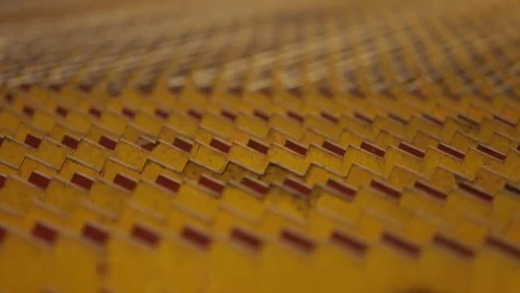Reinforcing steel bars moving between zigzag rigs of the conveyer closeup Stock Footage 72422987