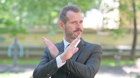Rejecting Gesture by Tense Middle Aged Businessman Stock Footage 287928782