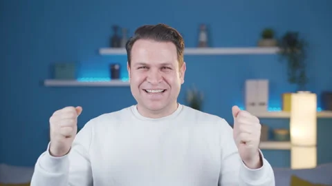 Rejoicing looking at the camera, the man is very happy and enthusiastic. Stock Footage 232281344