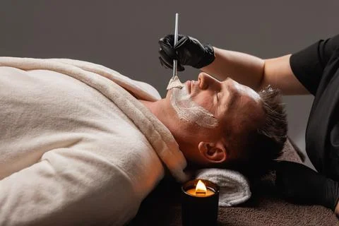 Rejuvenating Moisturizing Face Mask Application for Men, Spa Facial Skincar.. Stock Photos