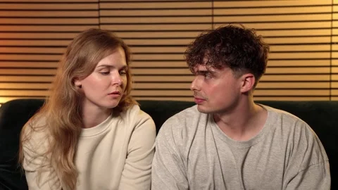 Relationship Conflict And Misunderstanding, Young Couple Sitting Apart On Sofa Stock Footage 335145708