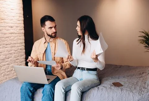 Relationship difficulties and obstacles. young couple with problems with bills Stock Photos