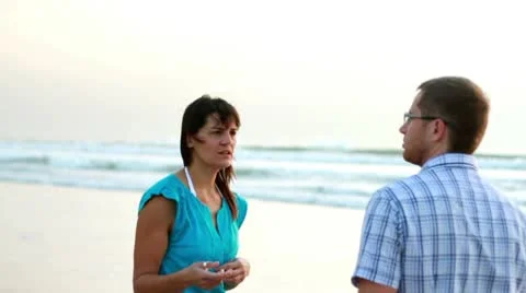 Relationship difficulties, young couple fighting by the beach, steadicam shot Stock Footage 10763865