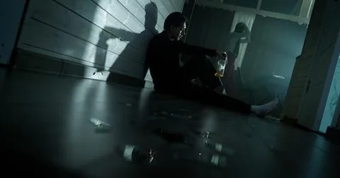 Relationship problem. Couple quarrel at home, drunk man alcohol addiction. Stock Photos