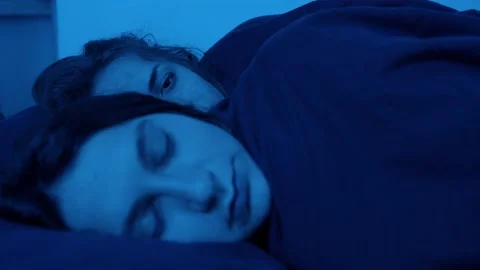Relationship problems-young lesbian sleeping with partner opens her eyes  Stock Footage 157503528