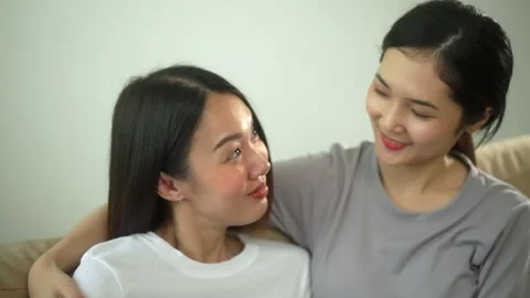 Relationship time of lesbian couple same-sex marriage embracing and expressing. Stock-Footage 245344406