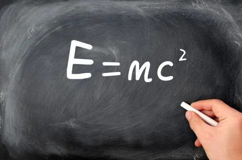 Relativity formula written on a  blackboard background Stock Photos