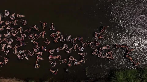 Relax and float with drinks on Pai River, perfect for travelers Stock Footage 303481386