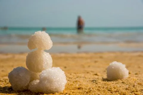 Relax balls of salt on the sand. Sky horizon. Sea. Sand. Stock Photos