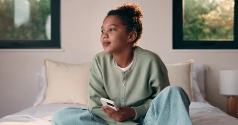 Relax, child and thinking with phone on bed for emotional processing, online Stock Footage 335520214