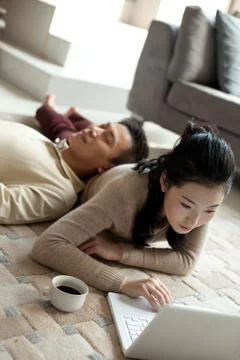 Relax. Get down. Focus. Asian Laptop Adult Man and friend Girlfriend Oriental Stock Photos