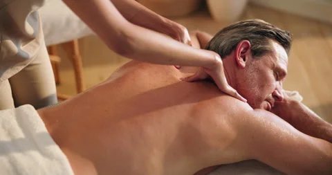 Relax, man or therapist at spa with back massage, deep tissue or luxury service Stock Footage 346301843