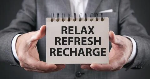 Relax, Refresh, Recharge on notepad. Stock Photos
