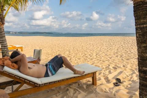 Relax time on the beach with book Stock Photos