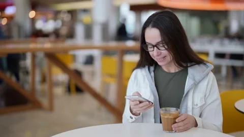 Relax time in cafe in daytime, coffee break in working day, lady is chatting 動画素材 169843101