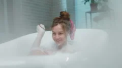 Young Woman Going To Take Bath in Her Bathroom. Stock Video - Video of  people, enjoying: 65919139