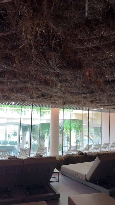 Relaxation area with hay ceiling and pool view Stock Footage 307227963