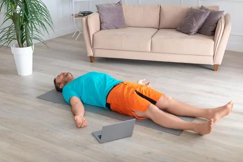 Relaxation practice with online tutorial. Yoga - shavasana. 写真素材