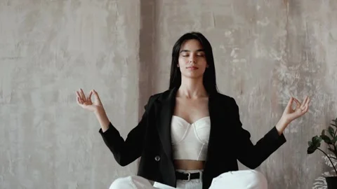 Relaxation.Oriental model A yoga practitioner doing exercises on a table  Stock Footage 205086710