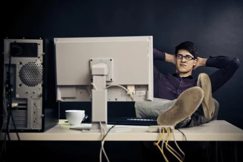 Relaxed Admin At His Desk 写真素材