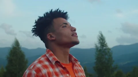 Relaxed african american male tourist breathing and enjoying fresh mountain air Stock Footage 159201495