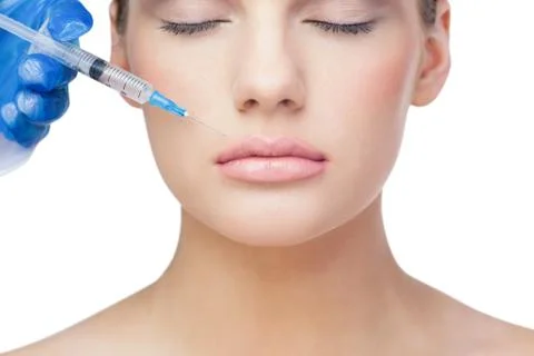 Relaxed beautiful blonde having injection above the lips Stock Photos