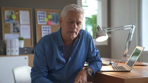 Relaxed business manager talking to camera in modern office Stock Footage 99767856