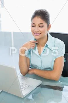 Relaxed businesswoman with eyes closed using laptop in office Stock Photos