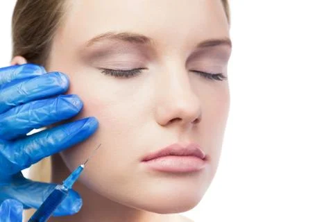Relaxed cute model having botox injection on the cheek Stock Photos