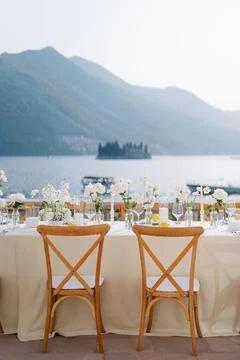 Relaxed destination wedding with soft sunset lighting and floral accents Stock Photos