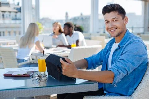 Relaxed freelancer working on tablet computer Foto stock