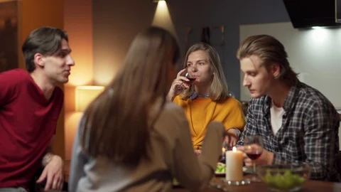 Relaxed friends talking at dining table Stock Footage 114814112