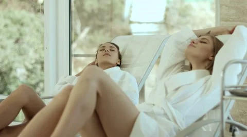 Relaxed Girls in Bathrobes on Lounger in The spa Stock Footage 59105676