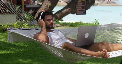 Relaxed handsome young multi-ethnic man programmer developer, freelancer Stock Footage 220597049