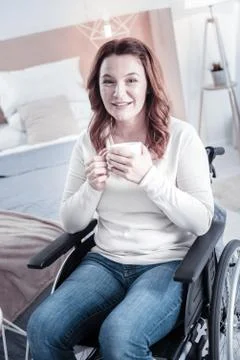 Relaxed invalid woman having tea break 写真素材