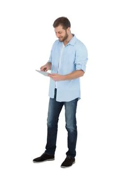 Relaxed male model using his tablet pc Foto stock