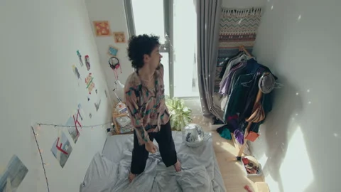 Relaxed Man Dancing on Bed at Home Stock-Footage 235656016