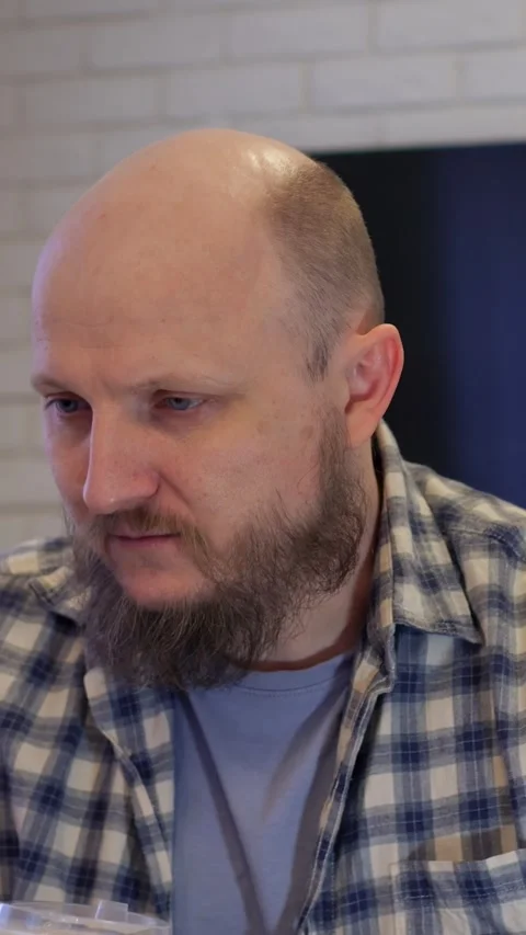 Relaxed man drinking coffee pause. Individual in plaid shirt relaxes with coffee Видео 344741450