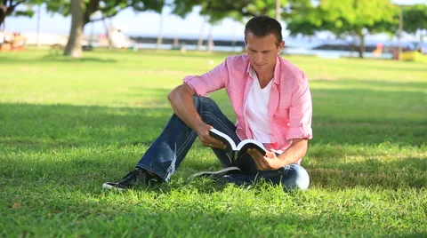 Relaxed Man Reading Book In The Park Stock Footage 55583431