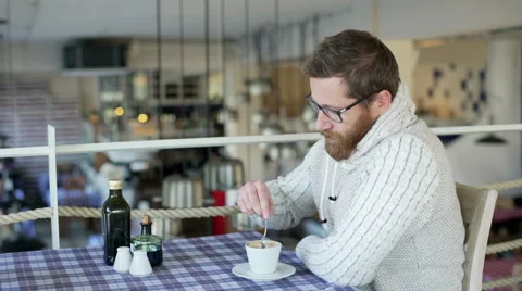 Relaxed man sitting in the restaurant and drinking coffee Stockbeeldmateriaal 58181253