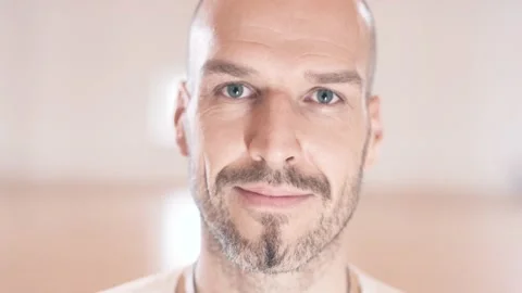 Relaxed man smiling into the camera Stock Footage 132705947