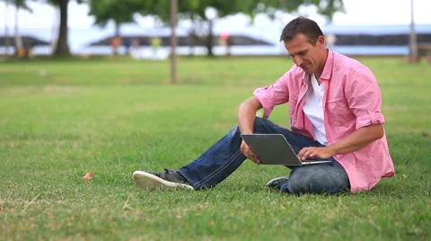 Relaxed Man Using computer In The Park Stock Footage 55610469