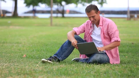 Relaxed Man Using computer In The Park Stock Footage 55611457