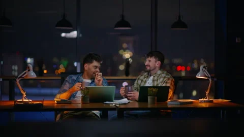 Relaxed men talking office sipping tea together. Positive guys taking break Stock Footage 339300097