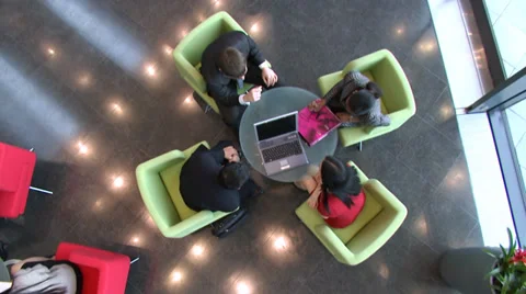 Relaxed office workers on a coffee break in large financial building.  High Vídeo Stock 32719069