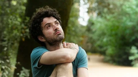 Relaxed pensive man alone in the forest Video stock 78251789